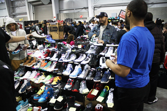 Ariel Gonzalez (l) with his sneaker collection -few-customers